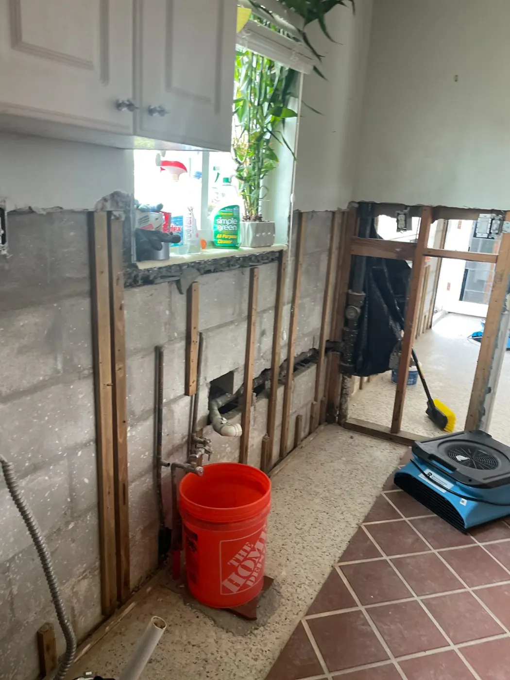 Flood-cut room with professional drying equipment running